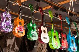 Synthesizer, guitar, saxophone and violin lying on the sheets for. 16 Small Musical Instruments You Can Easily Take With You On A Trip