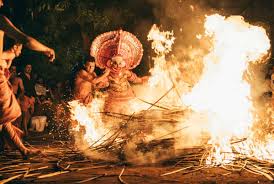 Experience Intense and Colorful Theyyam Fire Ceremony in Kerala India