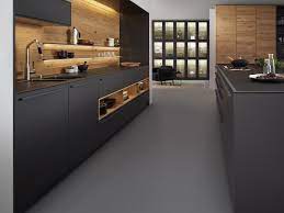 On the right is a midnight blue tile wall that makes the cooking space feel huge by raising the eye upward. Leicht Houston Luxe Interiors Design Modern Kitchen Luxury Kitchens Interior Design Kitchen