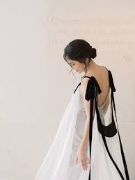 A reception dress by no means has to be more casual than your wedding dress. Fine Art Black White Wedding Inspiration With A Flowy Gown Ruffled