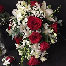 Cascade Bouquet Of White Lilies Red Roses White Orchids And Baby S Breath With Eucalyptus Wedding Flowers Eucalyptus Bouquet Cascade Bouquet