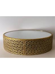 The round mirror is surrounded by a thin gold band, which is then encased in an iron frame. Florentine Gold Mirror Cake Stand Outlandish Events