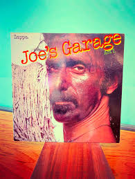 ⚡️Pre-Loved Wednesday drop! That's Miles holding up “Songs In The Key of  Life”, and that's one of his paintings behind him. We have several of his  works for sale, which all come