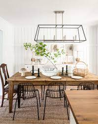 Impress your guests with a black dining table and a set of matching chairs, then brighten the room with a colorful tablecloth and corresponding napkins. Happy Spring Lauren Liess Wire Dining Chairs Black Dining Room Mismatched Dining Chairs
