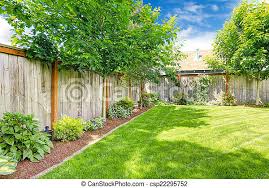 Blooms aren't traditional for japanese gardens but if you want some, rock them to show that it' not only a japanese. Fenced Backyard With Lawn And Flower Bed Backyard With Wooden Fence Green Lawn And Flower Bed With Maple Trees Alongside Canstock