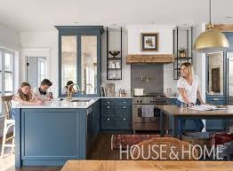 Deep Blue Cabinets Rustic Accents And Gold Toned Hardware Give This Montreal Kitchen The Classic Euro Kitchen Interior Kitchen Remodel Interior Design Kitchen