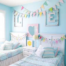 Fun dark blue girls room with boho touches like a macrame chair, fun art, colorful moroccan shag rug and a slime crafting area. 15 Perfect Paint Colors For Girls
