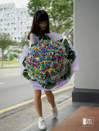 In recent years, green has become extremely popular thanks to the tropical wedding theme trend, but as one of the top wedding colors of 2021, green will take on a much more eclectic—and almost retro—vibe. Colour My Life 99 Rainbow Rose Bouquet