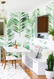 #tropical wallpaper #babana leaves #interiors #plants #nature #wooden table #home decor #vase #ideas #diy #summer #tropic. 7 Tropical Wallpapers To Decorate Your Home With Domino Tropical Home Decor Wallpaper Living Room Interior Design