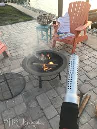 You could make a tipi style shelter and leave a hole in the top. Fire Pit Tips And Tricks You Probably Don T Know But Should H2obungalow