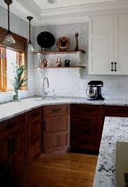 Dark Wood And White Cabinets Plus Black Metal Handles And Marble Countertops F Kitchen Remodel Small Home Kitchens Kitchen Renovation