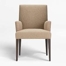 This arm chair features curved arms, a plush seat and spool legs in trending black or gray. Dining Arm Chairs Crate And Barrel