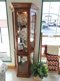 Show off your favorite trophy collection in a corner curio cabinet. Half Hexagon Glass Curio Cabinet Roth Brader Furniture