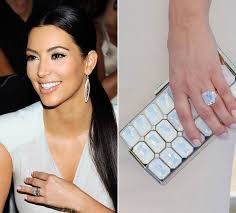 Her new husband and a wedding ring. Kim Kardashian S Engagement Ring From Kris Humphries Sells For 620 000 In Auction Hello
