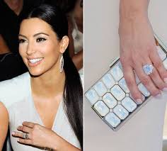 Kim kardashian will walk down the aisle yet again, thanks to a giant diamond and kanye west's jumbrotron proposal monday night at san all hail, kimye! Kim Kardashian S Engagement Ring From Kris Humphries Sells For 620 000 In Auction Hello