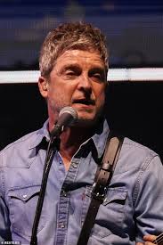 Proof the feud is well and truly OVER! Emotional moment brothers Liam and  Noel Gallagher hold hands and hug as they reunite