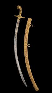 A gilt-copper hilted steel sword ...