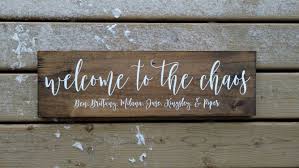 Funny Wood Signs Welcome Sign Personalized Welcome To The Chaos With Door Signs Diy Welcome Sign Personalized Signs It makes it easier for your service member to spot you and makes for great pictures. personalized signs
