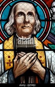 Saint Pothin church. Stained glass window. Saint John Vianney, was a French  Catholic priest who is venerated in the Catholic Church as a saint and a  Stock Photo