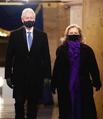 While the pantsuit has been properly executed by many female celebrities in the past, for some reason, hillary just can't seem to get it right. Hillary Clinton In Purple Suit Pointy Boots On Inauguration Day 2021 Footwear News