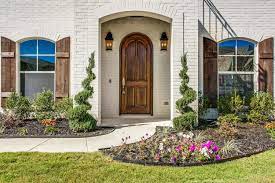 A heavyweight for modern exteriors 10 creative designs for brick patios and walkways should you paint your brick house? Cedar Stained Shutters Light Painted Brick Landscape Texas Home Aledo Home Bannister Custom Homes Painted Brick House Brick Exterior House House Shutters