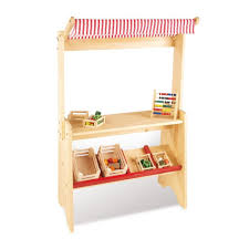 Petite Marchande En Bois Pinolino Jeux Et Jouets Enfant Smallable Loja De Brinquedos De Madeira Estantes De Mercado Criancas