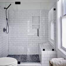 Rustic white brick walls against charcoal mosaic shower floor tiles surrounded by a feature floor of unique patterns that bring together all the color elements in this bathroom. 75 Beautiful Pebble Tile Floor Bathroom Pictures Ideas August 2021 Houzz