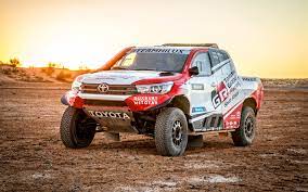 download wallpapers toyota hilux 2018 sunset dakar rally 2018 desert sand rally cars besthqwallpapers com toyota hilux toyota rally car