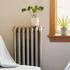 Black radiators old radiators white wooden floor new york apartments mid century modern living room parquet flooring minimalist home. How To Cool Down A Hot Apartment In Winter