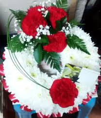 Red roses are the most common red flowers, but other red funeral flowers include red carnations, red gerbera daisies, red tulips, red antheriums, red ginger, and red hypericum berries. Red Carnation Funeral Wreath Funeral Flowers The Little Flower Shop