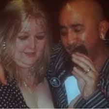 Could you remove my wife's "double chin" please? It's the camera angle....  My wife is so beautiful but she doesn't like this pic and won't let me show  it. Thank you. 🙂