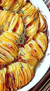 Crispy Potato Roast Sliced Potatoes Layered Sideways To Ensure Maximum Number Of Crispy Potato Edges And Potato Side Dishes Veggie Dishes Side Dish Recipes