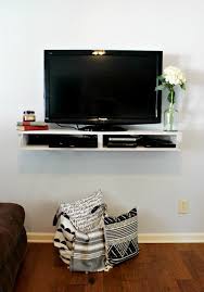 Use a stud finder to locate the studs in the wall that will hold your tv. Diy Floating Tv Shelf
