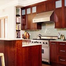 White wall paint color ideas for small kitchen with cherry cabinets. Love The Green Glass Backsplash With Cherry Cabinetry Kitchen Inspirations Kitchen Cabinetry Kitchen Decor