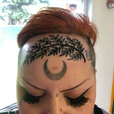 Image result for quirky pylon forehead tattoo
