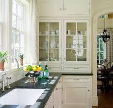 Cream Cabinets With Black Countertops Love The Glass Doors Alisberg Parker Arc Glass Fronted Kitchen Cabinets Country Kitchen Cabinets Glass Kitchen Cabinets