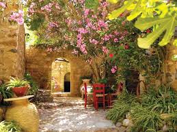 In Sun Drenched Gardens Shade Is Key Typical Mediterranean Courtyards Offer Seatin Mediterranean Landscaping Tuscan Garden Design Mediterranean Garden Design