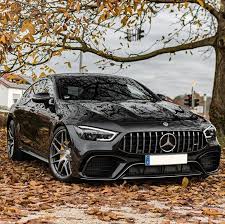 The Mercedes Amg Gt 63 S 4matic 4 Door Coupe Looks Ideal Among The Falling Leaves Fuel Consumption Combine Mercedes Amg Benz Car Mercedes