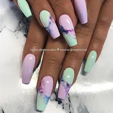 It's time to move beyond the regular round and square shaped nails. Lilac And Mint With Marble Effect On Long Coffin Nails Nail Artis Lilac Nails Lilac Nails Design Gold Glitter Nails
