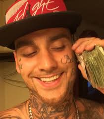 Bank robber John Mogan posts selfies with 'wads of stolen cash', gets  arrested