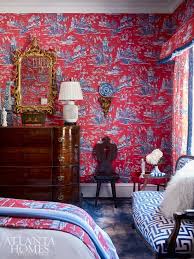 A red vignettes printed onto a white background. Red White Blue Toile Wallpaper Fabric Curtains Thibaut Dynasty Cheng Atlanta Showhouse 2018 The Glam Pad