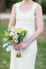 New unity wedding idea, the beautiful unity cross assembled by the bride and groom. Floral Crochet Wedding Dress And Wildflower Bouquet