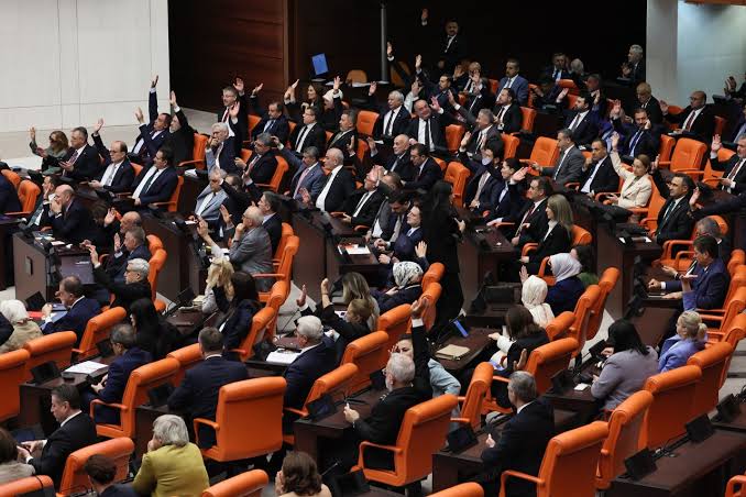 Members of the Turkish Grand National Assembly voting on the new peace process legislation in Ankara.