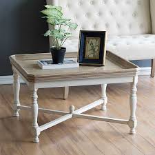 The furniture's existing finish, whether varnished or painted, shows through the new paint after it's whack random areas of the table and chairs with a hammer to create dents and dings, adding a distressed look to the furniture. Natural Top White Base Distressed Coffee Table Kirklands