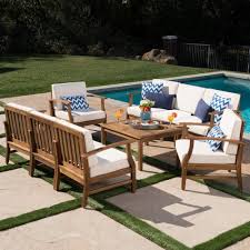 Noble House Giancarlo Teak Finish 9 Piece Wood Outdoor Sofa Set With Cream Cushions Outdoor Sofa Sets Outdoor Sofa Sofa Set