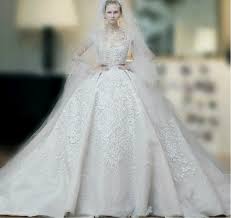 He has become a recognized name for dressing royalty and celebrities. Elie Saab Wedding Dresses 2015 Ball Gown High Neck Sleeveless Beaded Applique Tulle F Best Wedding Dress Designers Wedding Dress Prices Elie Saab Wedding Dress