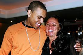 Hawkins' face was also partially hidden behind a matching red and black face mask. Chris Brown Mom Joyce Hawkins