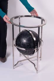 The main characteristic of the table is the support for the glass top which consists of a sphere in. Cavendish Adventures Polished Nickel Globe Coffee Table