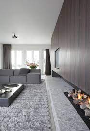 dit prachtige grachtenpand in amsterdam is een goed voorbeeld van dat werken met grote objecten openhaard ontwerp huis interieur design thuis woonkamer