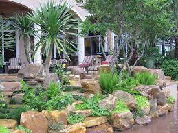 We have a utilities easement on this. Tropical Backyard Rock Garden Wall Kolonialstil Patio Miami Von Matthew Giampietro Garden Design Houzz